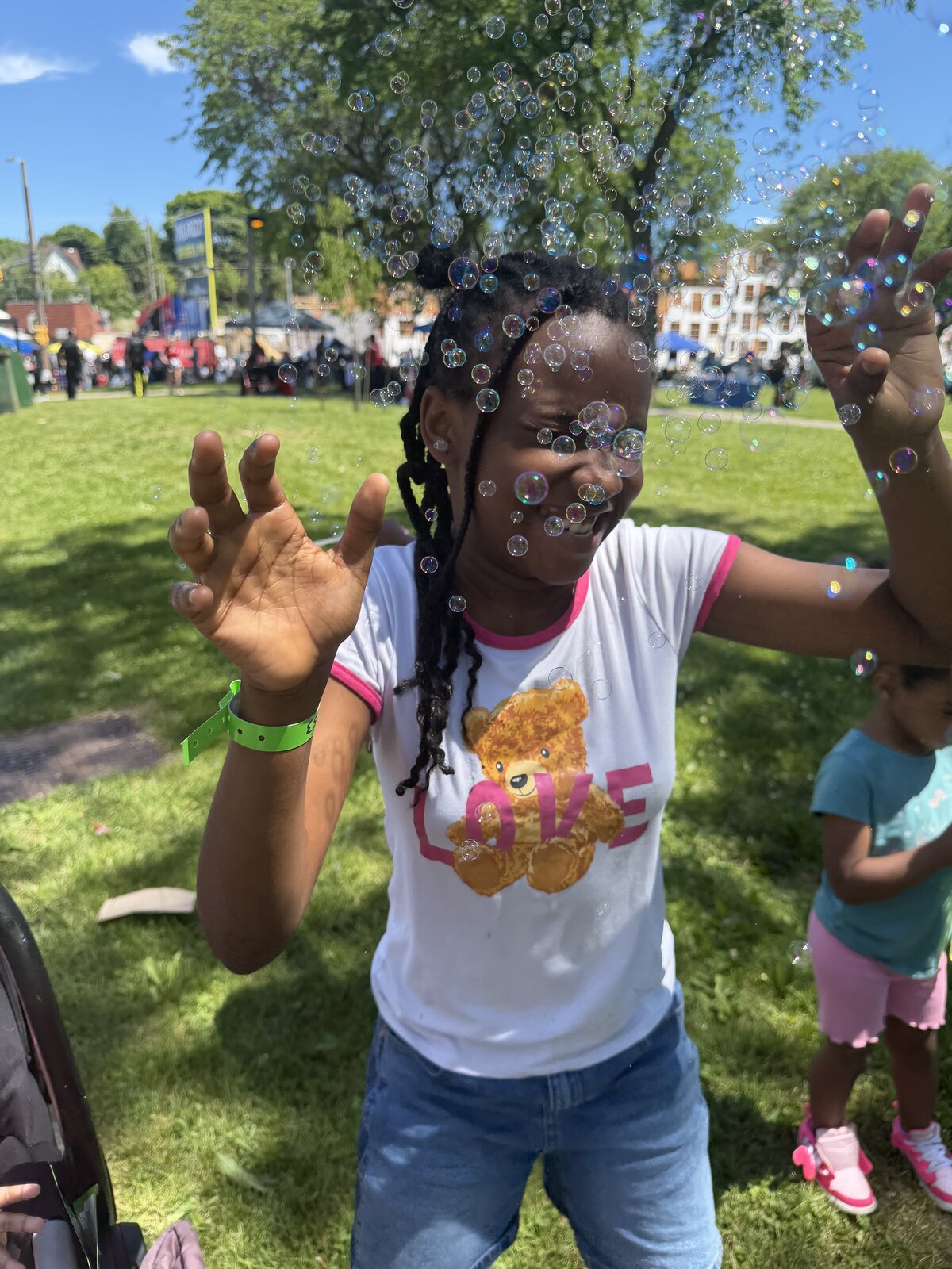 Chasing bubbles on a sunny day at Ready Step Grow